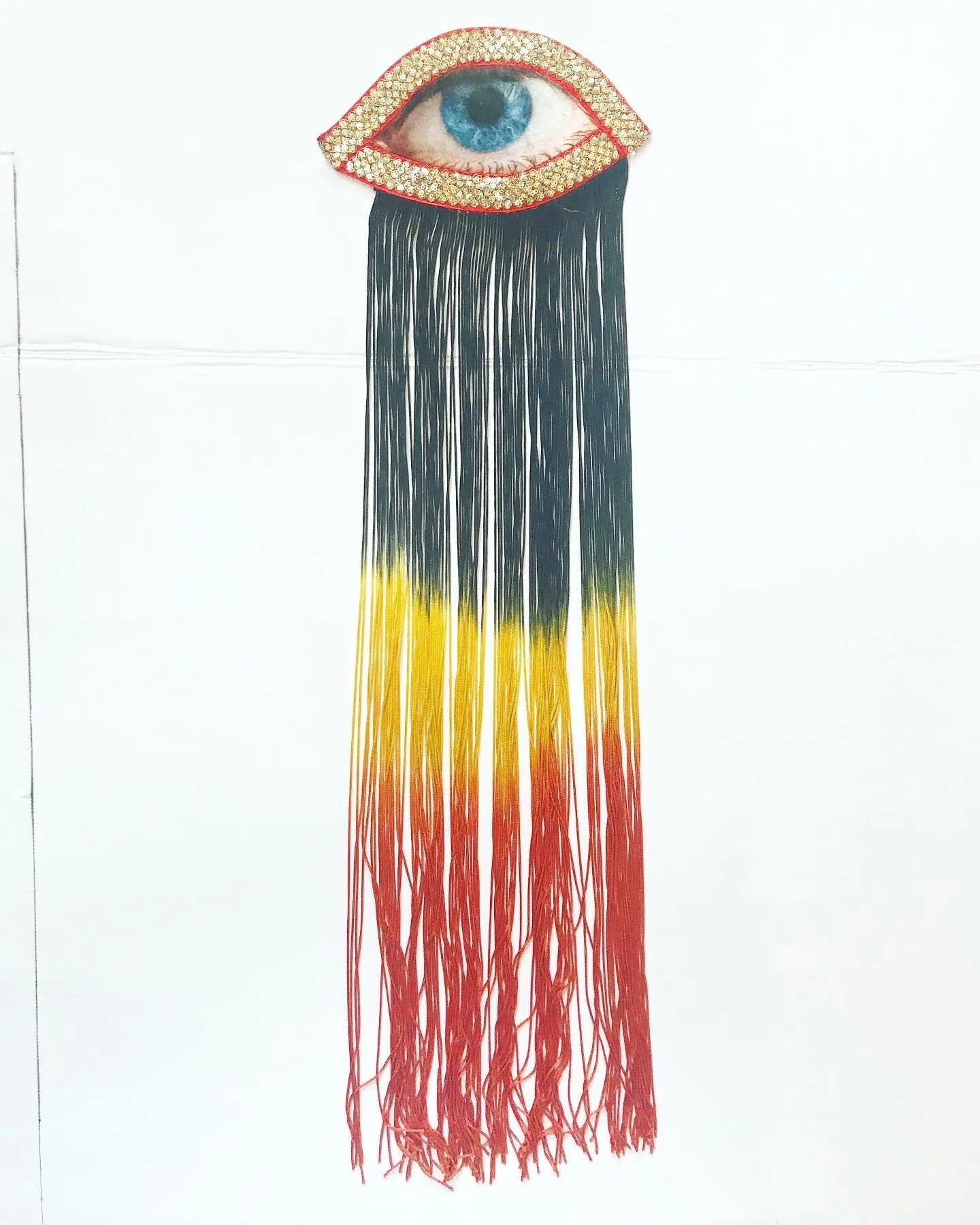 Eye Appliqué with Black/Yellow/Orange Ombre Fringe
