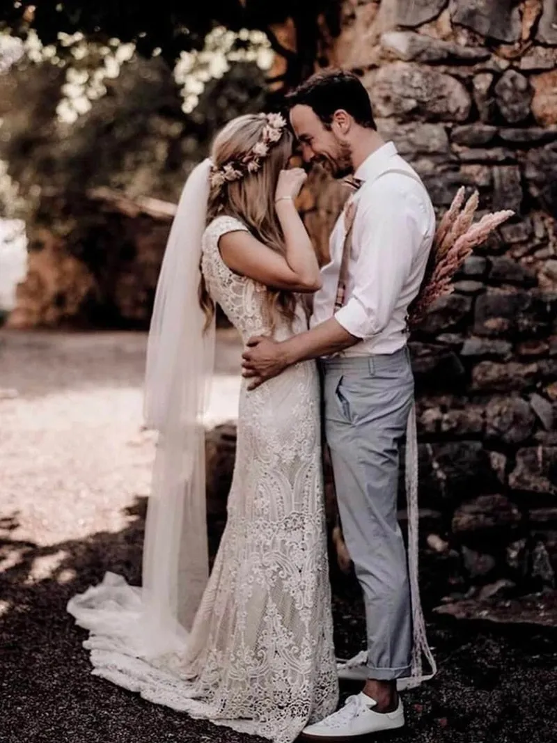 Wedding Dress Features Deep V-Neck Sexy Backless With Cap Sleeves Made In Lace Sheath Boho Style