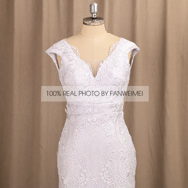 Wedding Dress Features Deep V-Neck Sexy Backless With Cap Sleeves Made In Lace Sheath Boho Style