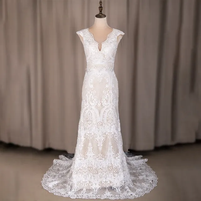 Wedding Dress Features Deep V-Neck Sexy Backless With Cap Sleeves Made In Lace Sheath Boho Style